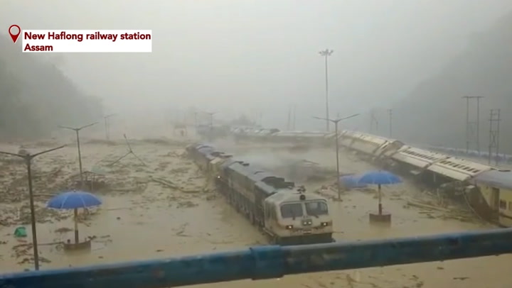 Train overturns in mud as flooding and landslides hit India