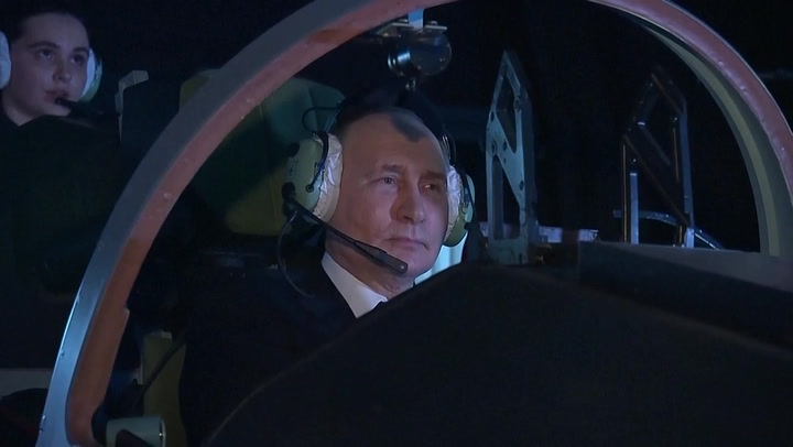 Putin tests out flight simulator during Russian aviation school visit