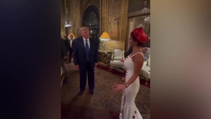 Donald Trump says woman wearing MAGA dress has ‘greatest outfit’ at event
