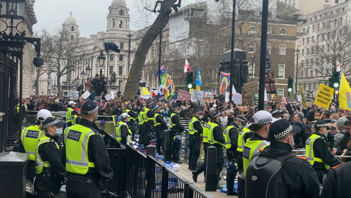 NHS staff throw uniforms at Downing Street police during protest