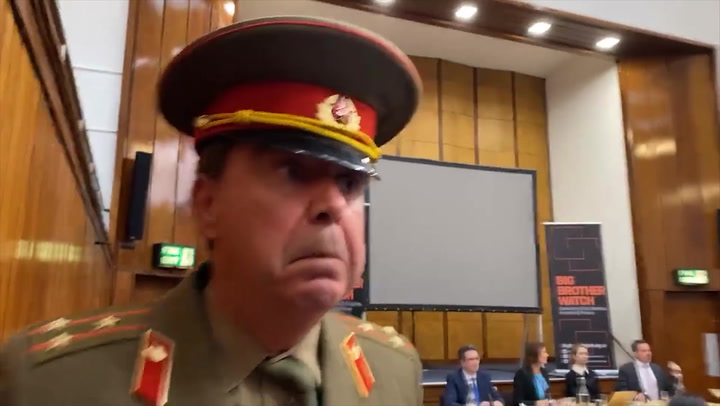 Anti-Brexit protestor interrupts Tory conference event in Soviet uniform