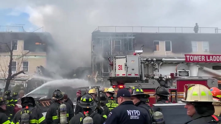 Firefighters battle huge blaze at collapsed NYC house after possible gas explosion