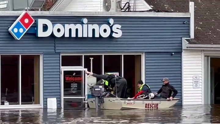 Domino's pizza diners rescued by boat from Connecticut restaurant during flood
