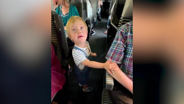 Toddler Walks Down Train Aisle To Greet Every Single Passenger