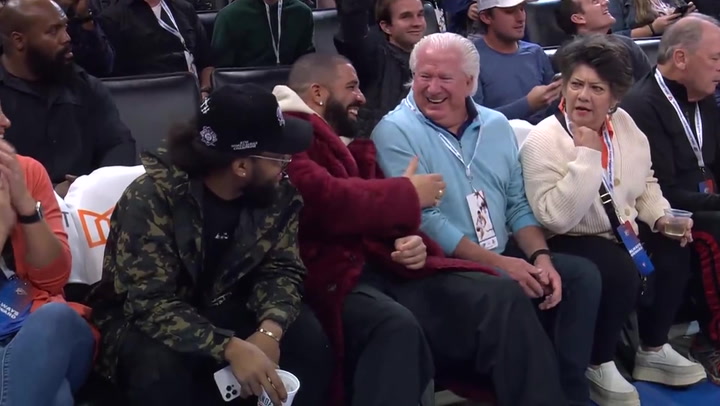 Drake befriends couple at basketball game who don't know who he is