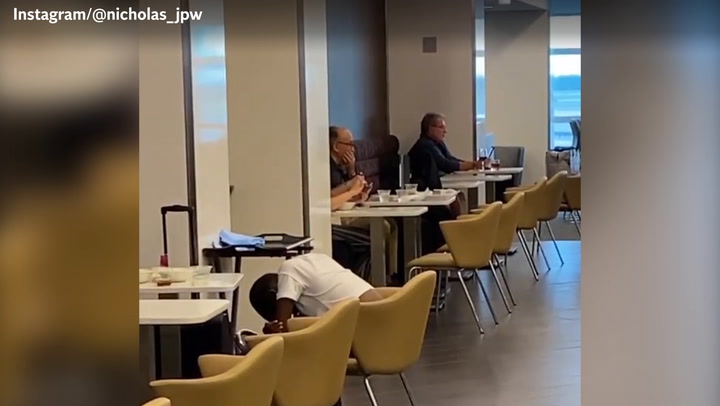 Bizarre moment Trump lawyer Rudy Giuliani spotted shaving in airport restaurant