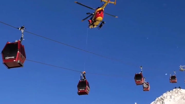 Dramatic moment stranded skiers RESCUED from cable cars in French Alps ...