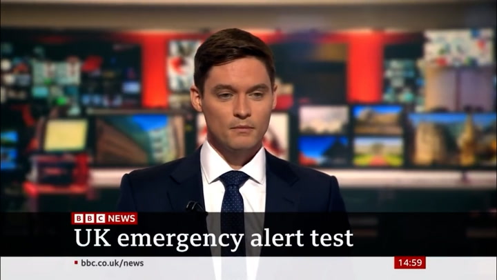 Moment BBC newsreader interrupted by emergency alert live on air