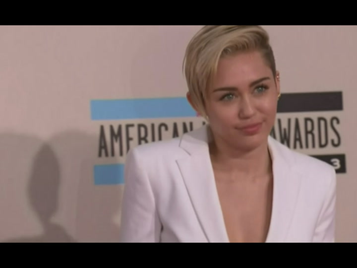 Miley Cyrus cries, swings around completely naked in 