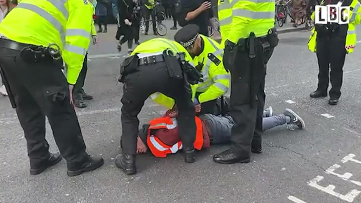 Commuter clashes with Insulate Britain protesters as arrests made