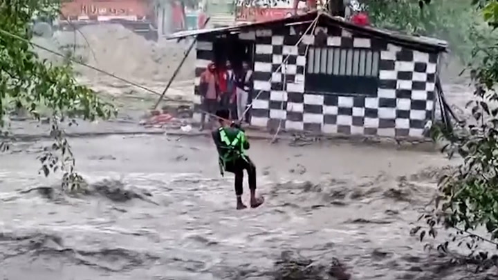 Stranded locals rescued by zipline as torrential floods hit India