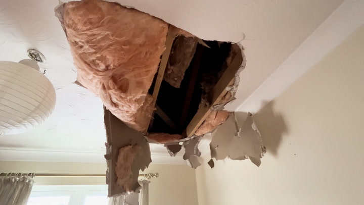Woman discovers huge hole in roof 'caused by ice from plane'