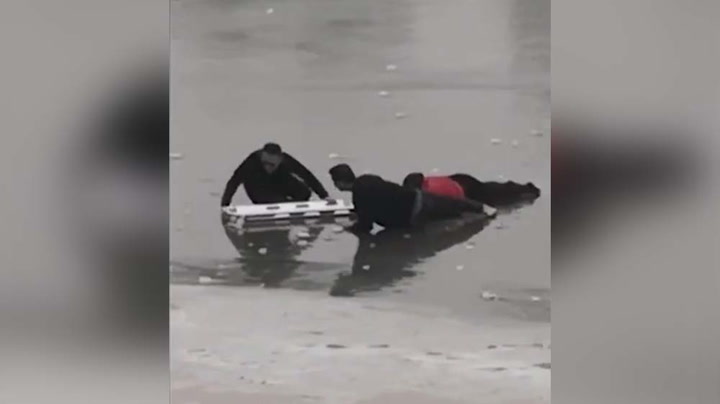 Woman Rescued After Falling Into Frozen Lake In Xianyang, China