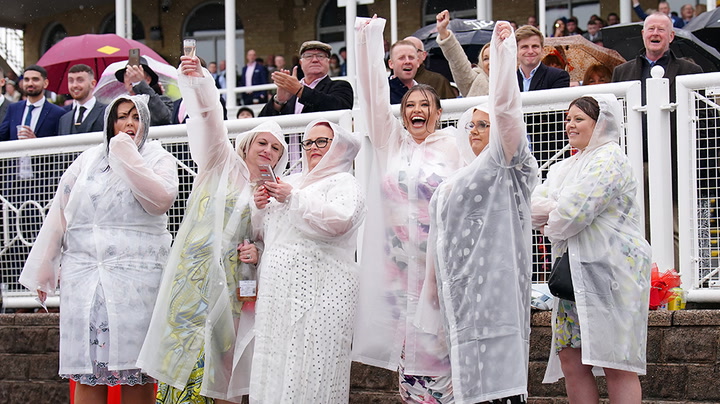 Ladies Day: Grand National racegoers don finest attire despite rain