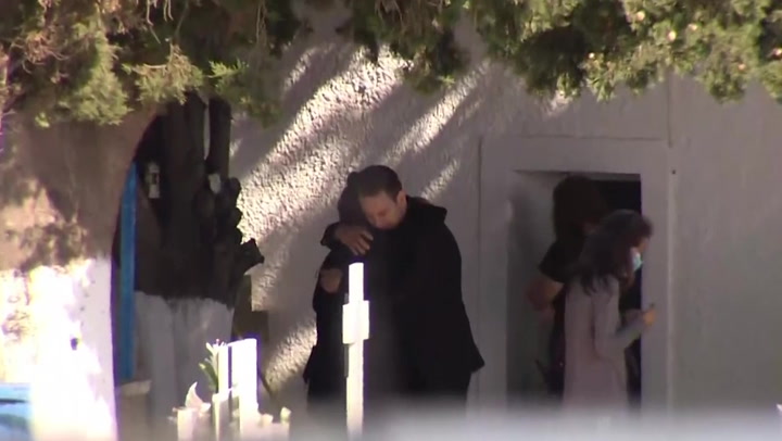 Greek pilot arrested over wife's death hugs victim's mother