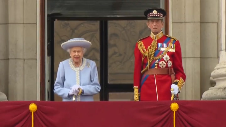 Queen stands on Buckingham Palace balcony to inspect troops alongside Duke of Kent