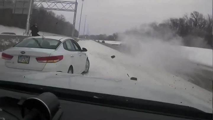 Truck smashes into police car narrowly missing officer on icy Ohio highway