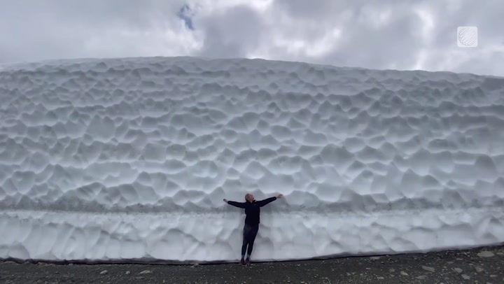 GIANT SIX-METRE-TALL SNOW WALLS ATTRACT TOURISTS IN WHISTLER, B.C.