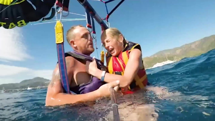 Couple's parasail gets entangled with another, sending them crashing into sea