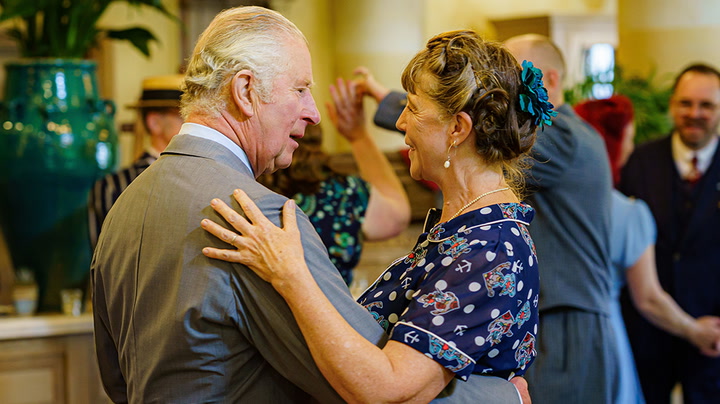 Prince Charles swings into jubilee with surprise appearance at tea dance