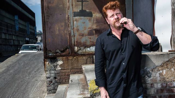 Michael Cudlitz smoking a cigarette (or weed)
