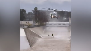 Man pulled from rushing floodwater in dramatic helicopter rescue