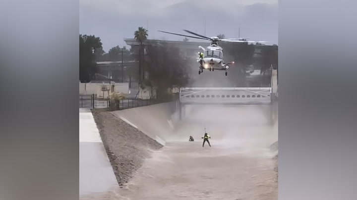 LA Firefighters Rescue Man And His Dog From LA Floods