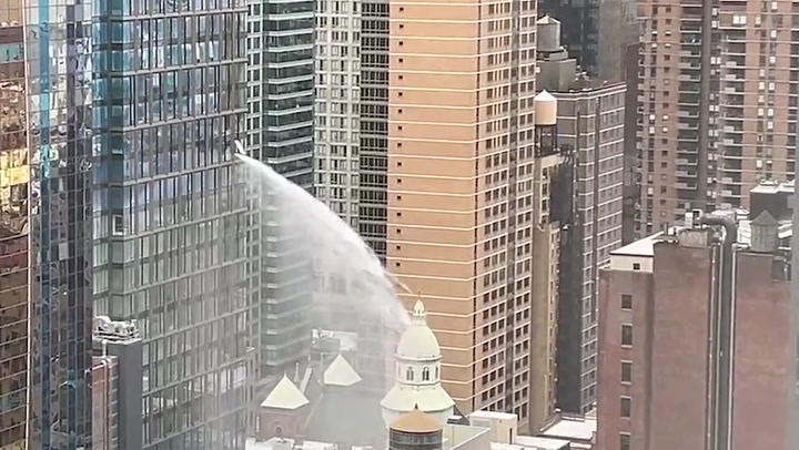 Wild video shows torrent of water bursting out of NYC high-rise