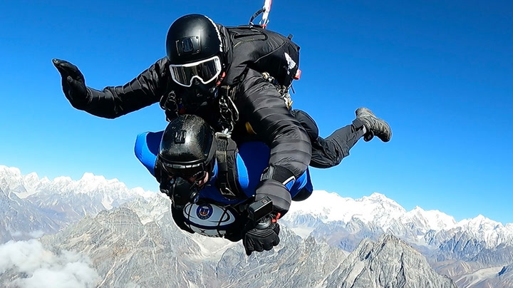 Former rugby player completes 24,000ft skydive while clutching ball