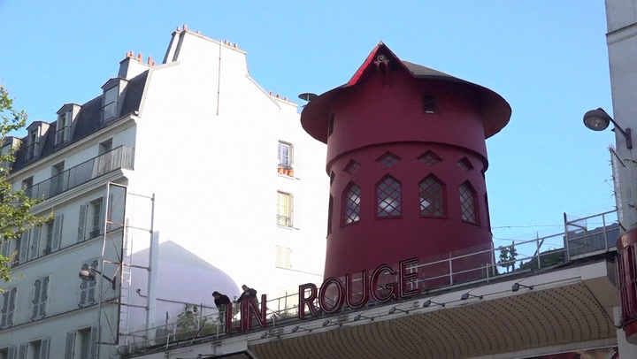 Moulin Rouge windmill blades lie in street after falling off overnight