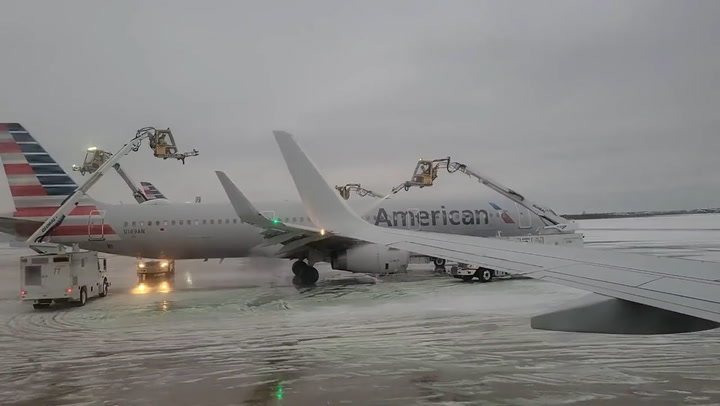 Planes de-iced at Dallas airport as temperatures plummet in Texas