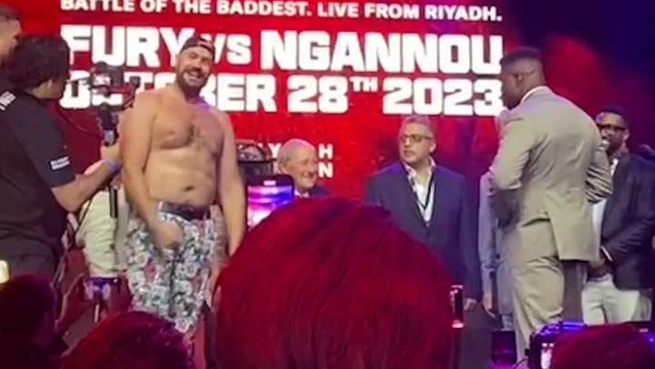 Topless Tyson Fury tries to get Francis Ngannou to take shirt off