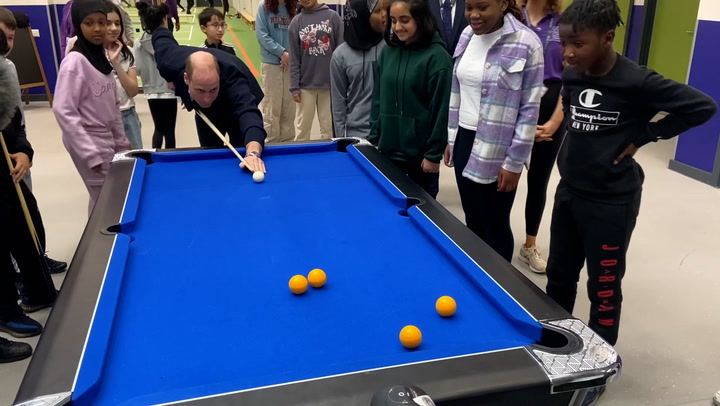Prince William jokes 'we could be here a while' as he plays pool and basketball on charity visit
