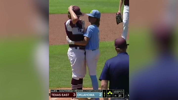 Baseball batter consoles pitcher who hit him in the head
