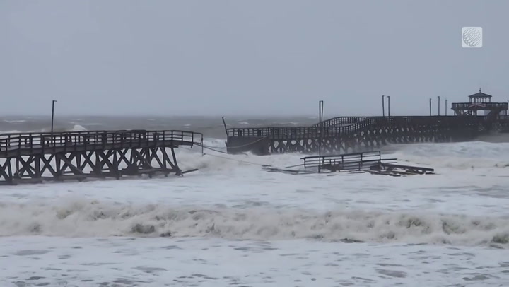 WATCH PIER LOSE ITS BATTLE WITH IAN'S WAVES ON MYRTLE BEACH