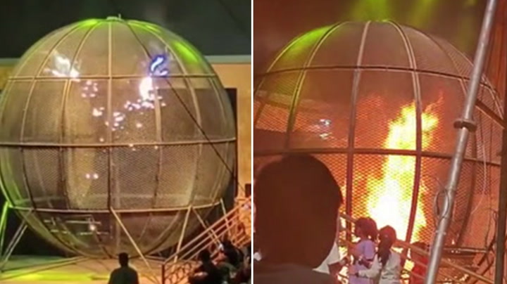 Moment motorcycle stunt erupts in flames during circus show
