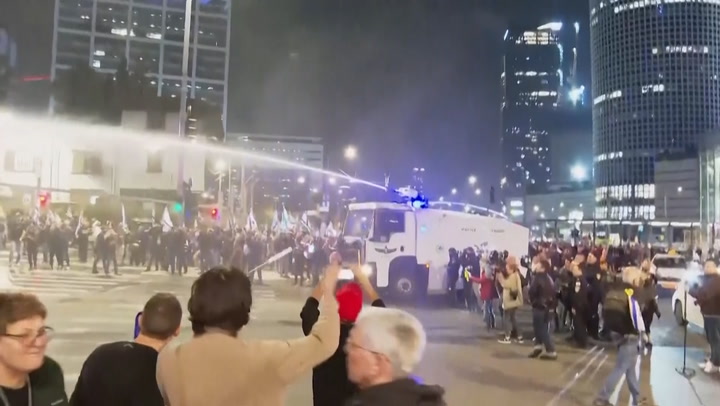 Police fire water cannon to disperse anti-government protesters in Tel Aviv