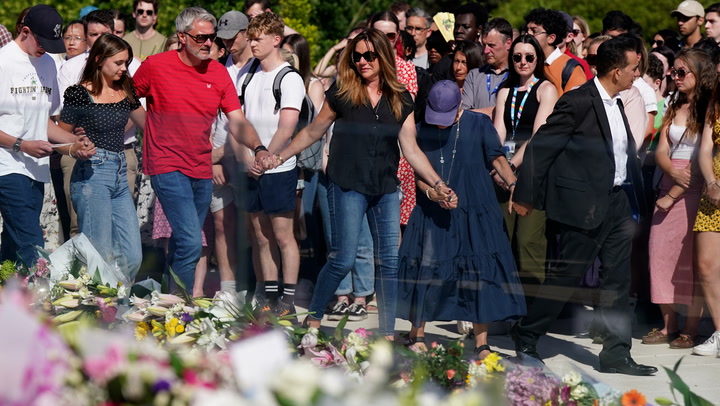 Family of Nottingham victims lay flowers at vigil attended by thousands