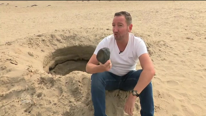 'Mysterious crater' appears on Irish beach but all is not as it seems