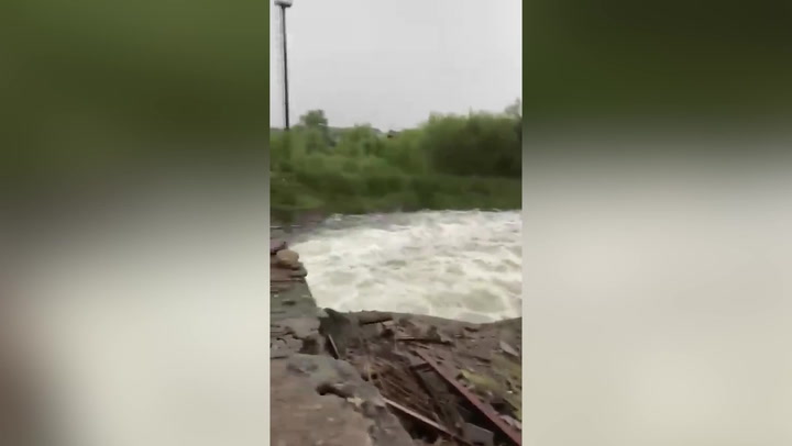 Water rushes over destroyed Ukrainian dam after Russian shelling