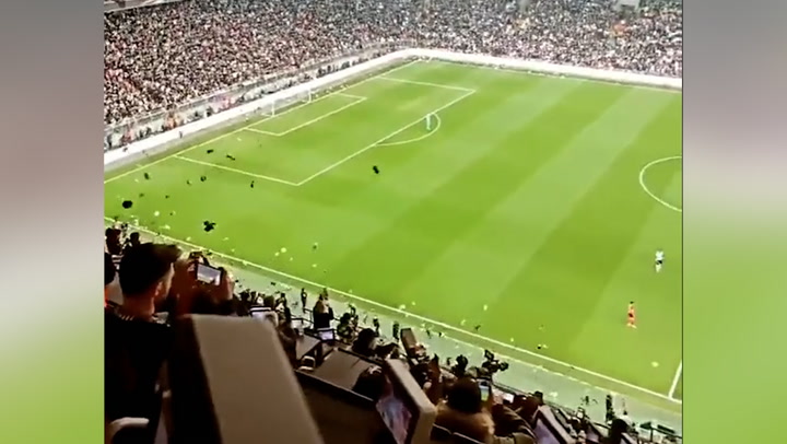 Besiktas and Antalyaspor football fans throw teddies onto pitch for earthquake victims