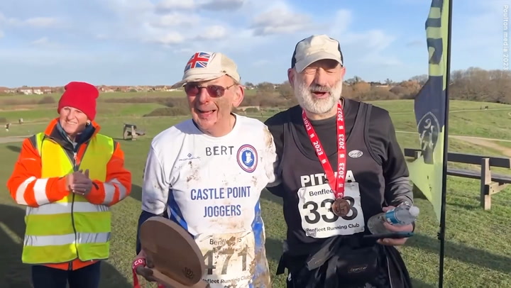 Moment one of Britain’s oldest runners completes muddy 15-mile race