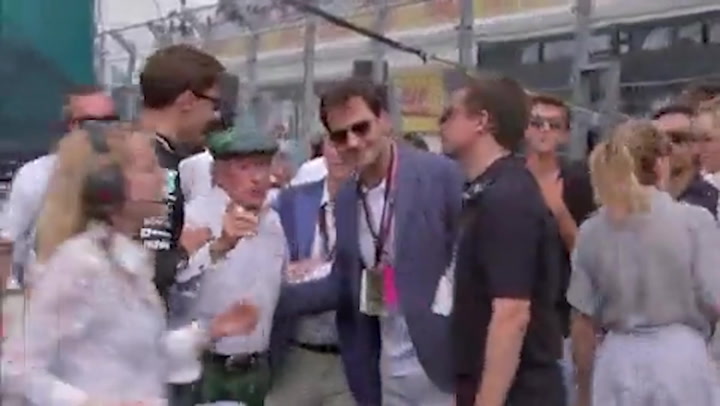 Jackie Stewart breaks through VIP barrier to help journalist interview Roger Federer