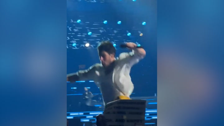 Nick Jonas falls through hole onstage during Jonas Brothers concert in Boston
