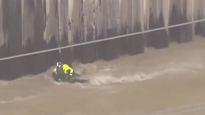 Man hangs on for life during helicopter rescue from raging Los Angeles river