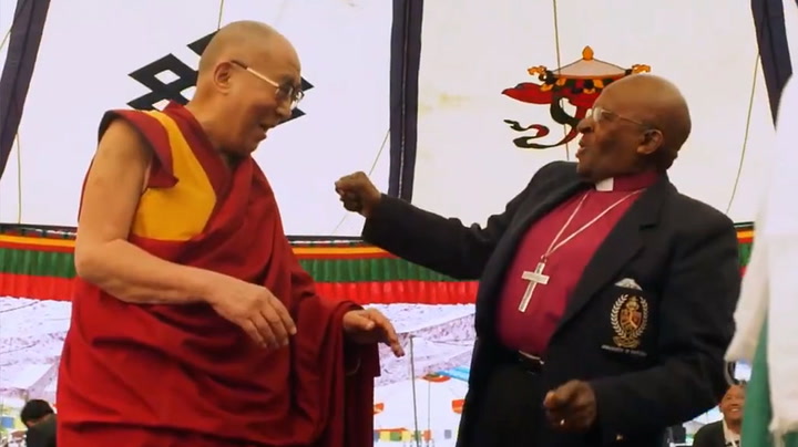Desmond Tutu and the Dalai Lama joke and dance in uplifting resurfaced footage