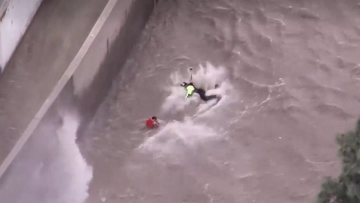 Dramatic aerial footage captures moment woman rescued from raging LA river