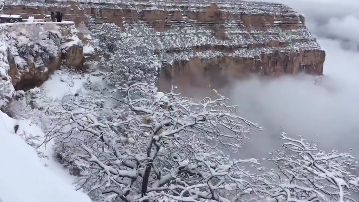 Snow and mist settle on Grand Canyon in stunning footage