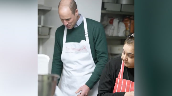 Prince William dons apron to serve food to the homeless in surprise charity visit