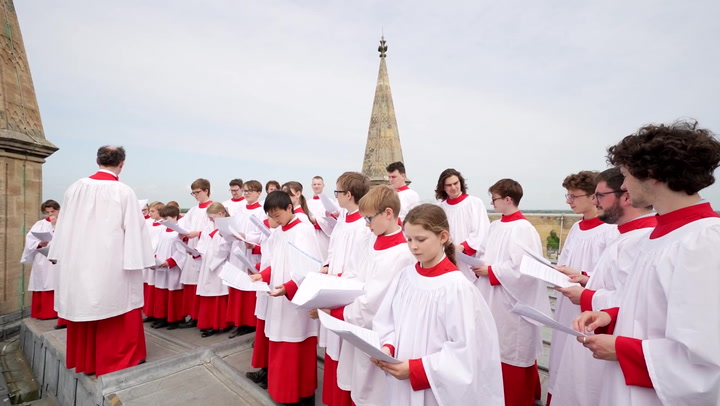 Choir sings on top of 163ft tower to carry on 102-year-old tradition